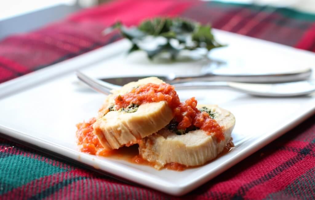 Elegant holiday dinner–ricotta and spinach chicken roulades with orange tomato sauce