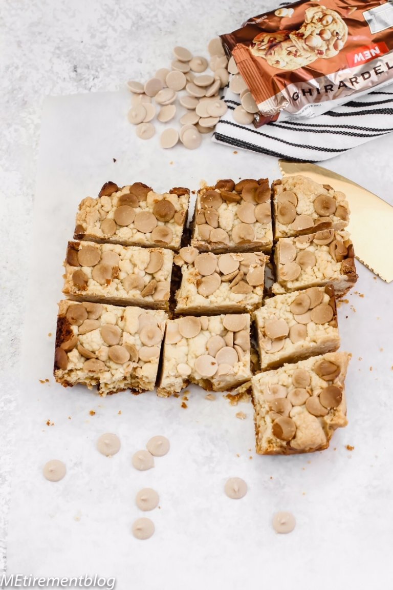 Caramel White Chocolate Blondies on marble slab with Ghiradelli caramel chips