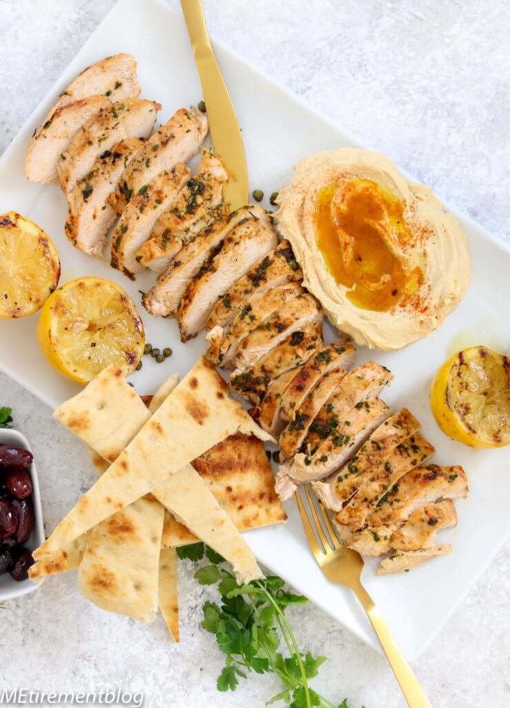 Mediterranean Grilled Chicken Platter with Hummus and Pitas