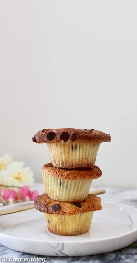 Crispy Top Orange Chocolate Muffins stacked on white plate