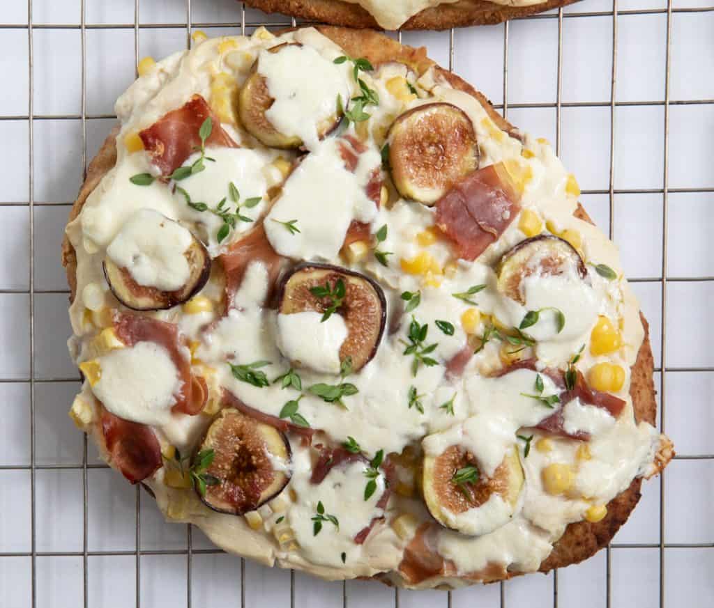 Single Fig Prosciutto Pizza with Cauliflower Ricotta Truffle Puree on Cooling Rack